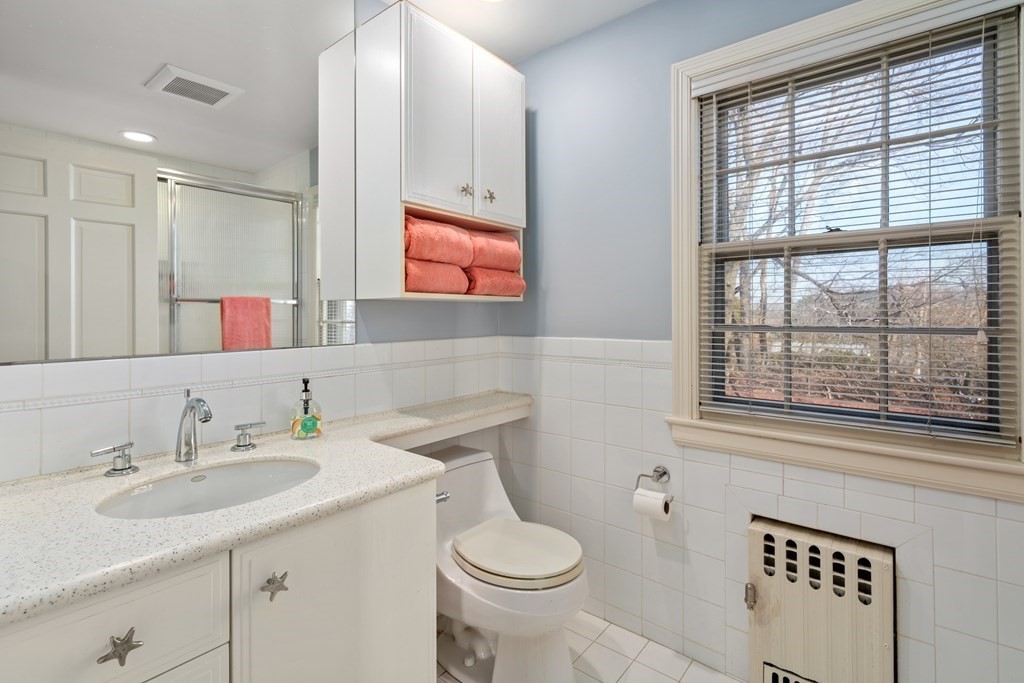 30 Terrace Drive Worcester, MA 01609 - Photo 32 of 39 a bathroom with a toilet sink and mirror