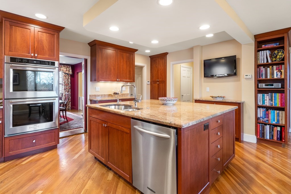 30 Terrace Drive Worcester, MA 01609 - Photo 5 of 39 a kitchen with stainless steel appliances granite countertop a stove and a wooden cabinets