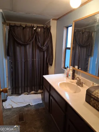 a bathroom with a sink and a mirror