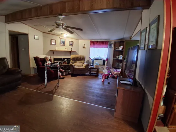 a room with lots of chairs and mirrors