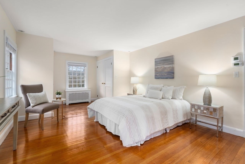 36 Rutledge Road Belmont, MA 02478 - Photo 12 of 23 a bedroom with a bed a lamp and a large window