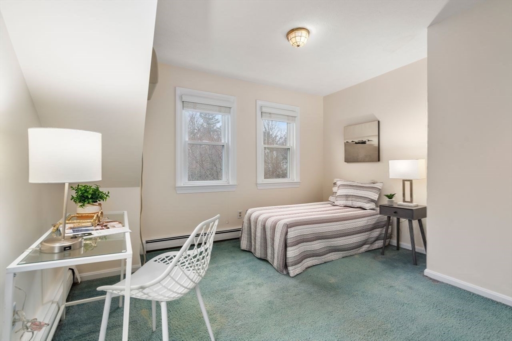 36 Rutledge Road Belmont, MA 02478 - Photo 17 of 23 a bedroom with a bed and a table