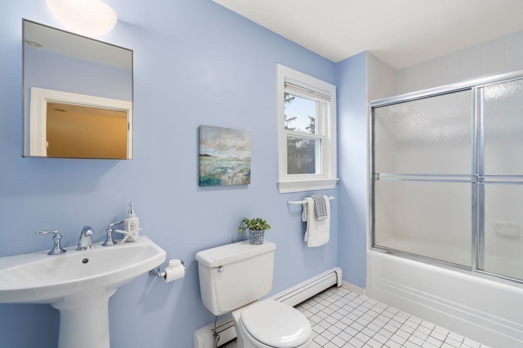 36 Rutledge Road Belmont, MA 02478 - Photo 18 of 23 a bathroom with a sink mirror vanity and toilet