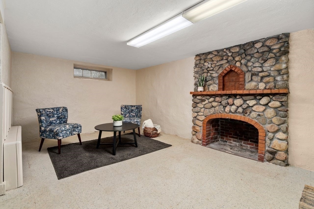 36 Rutledge Road Belmont, MA 02478 - Photo 19 of 23 a living room with furniture and a fireplace