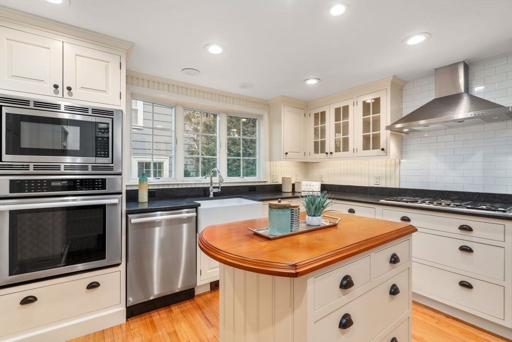 36 Rutledge Road Belmont, MA 02478 - Photo 10 of 23 a kitchen with a stove a sink and a microwave