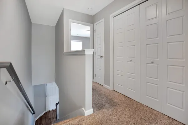 a view of an entryway with wooden floor