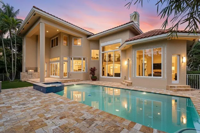 a front view of a house with swimming pool