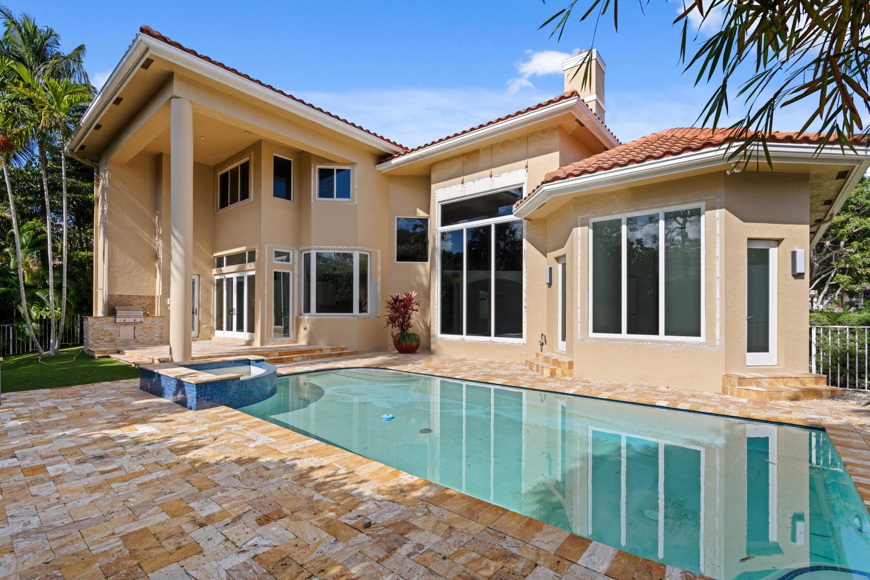3054 Northwest 60th Street Boca Raton, FL 33496 - Photo 18 of 48 a view of a house with a lounge chair