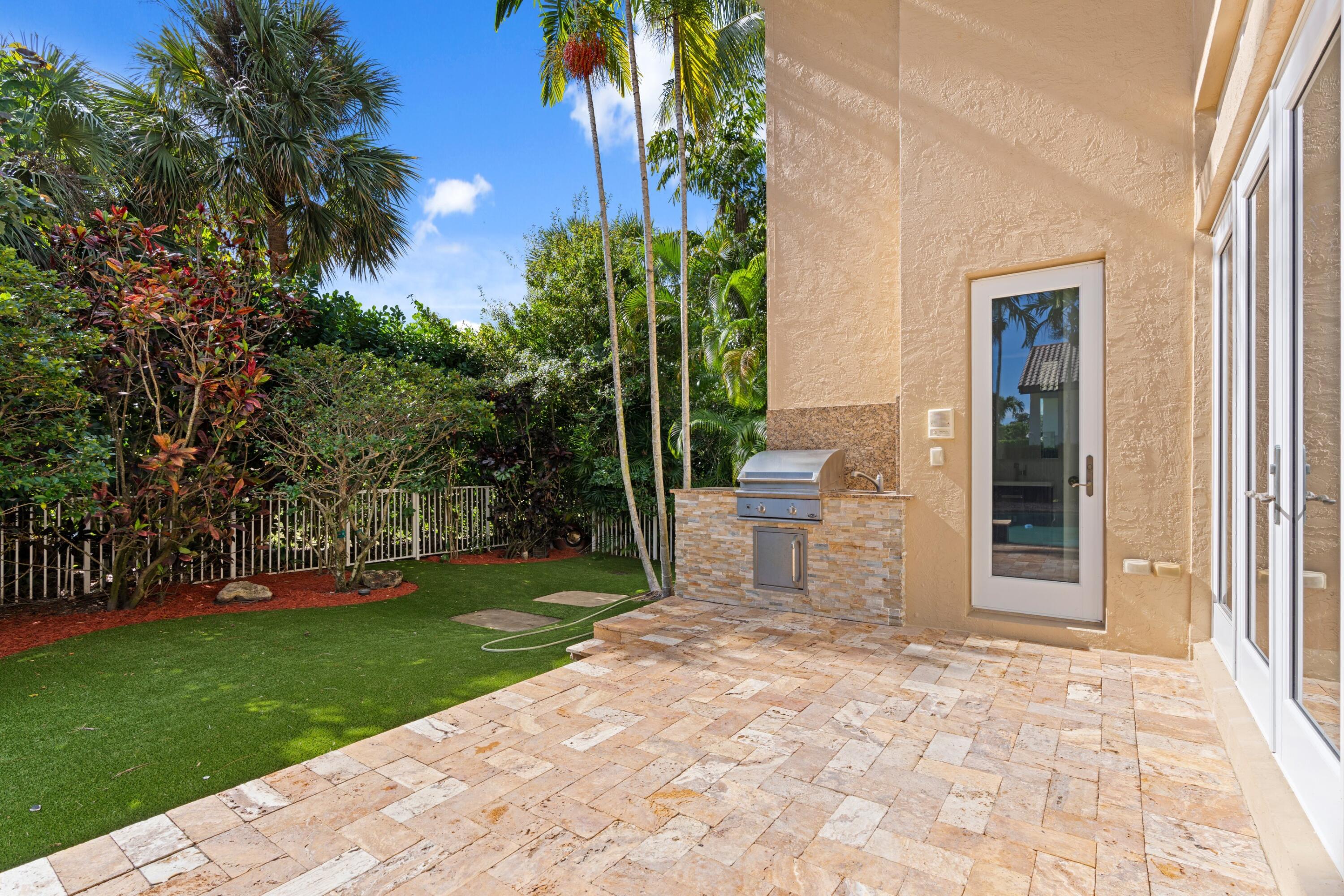 3054 Northwest 60th Street Boca Raton, FL 33496 - Photo 20 of 48 a view of a back yard of the house