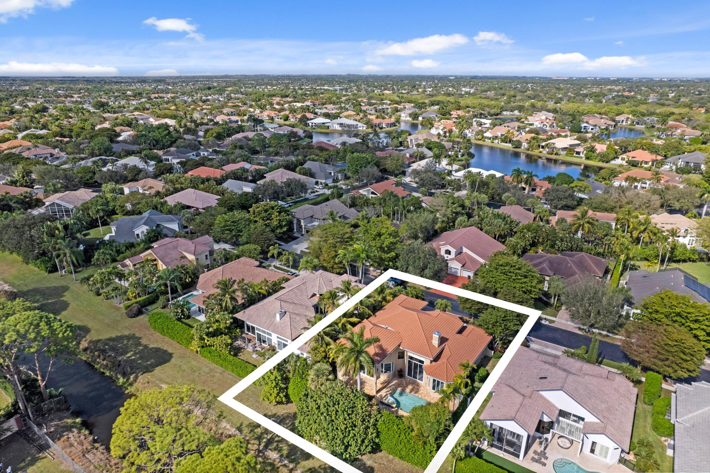 3054 Northwest 60th Street Boca Raton, FL 33496 - Photo 22 of 48 an aerial view of residential houses with outdoor space