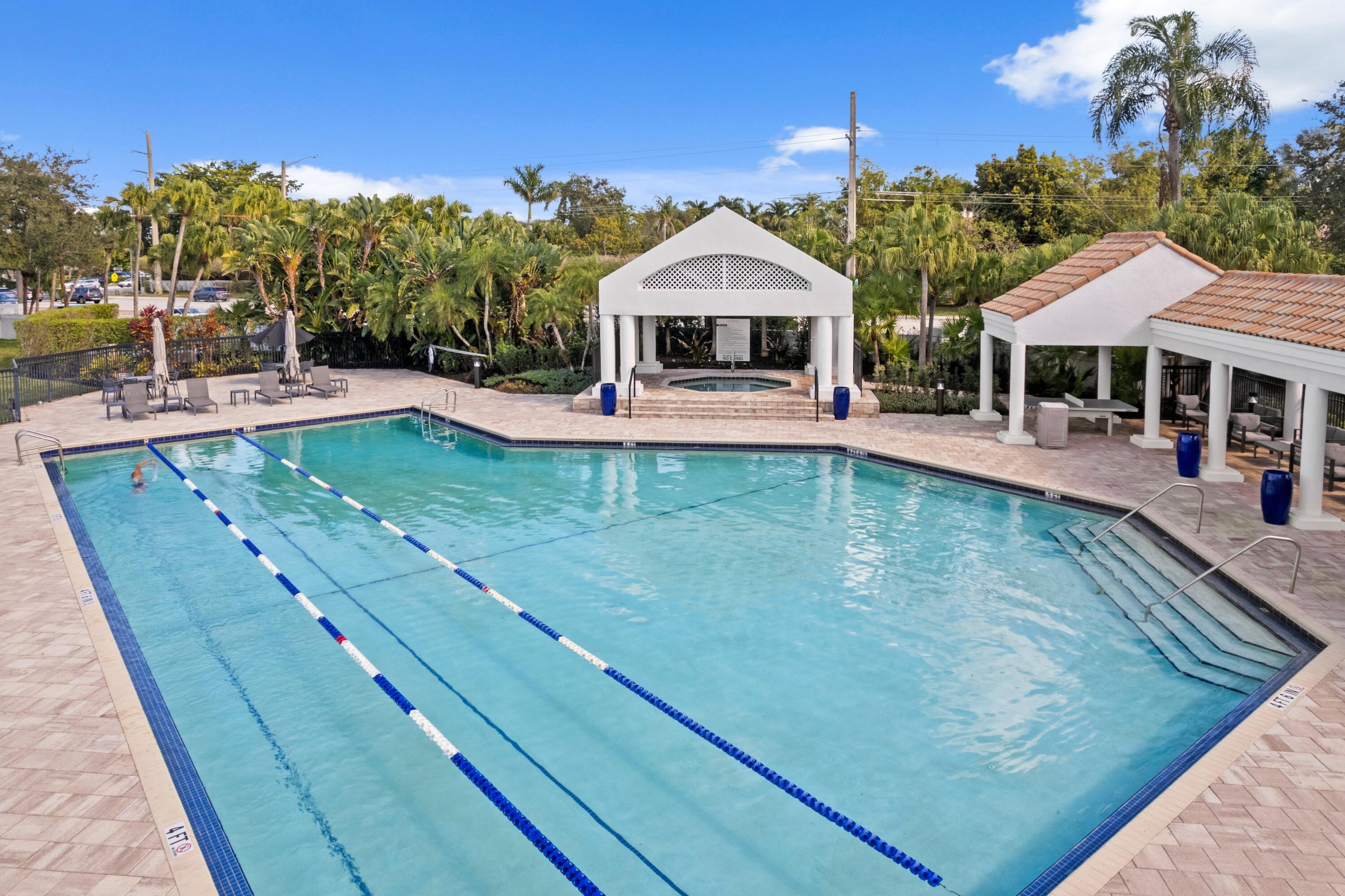 3054 Northwest 60th Street Boca Raton, FL 33496 - Photo 27 of 48 a view of a house with pool