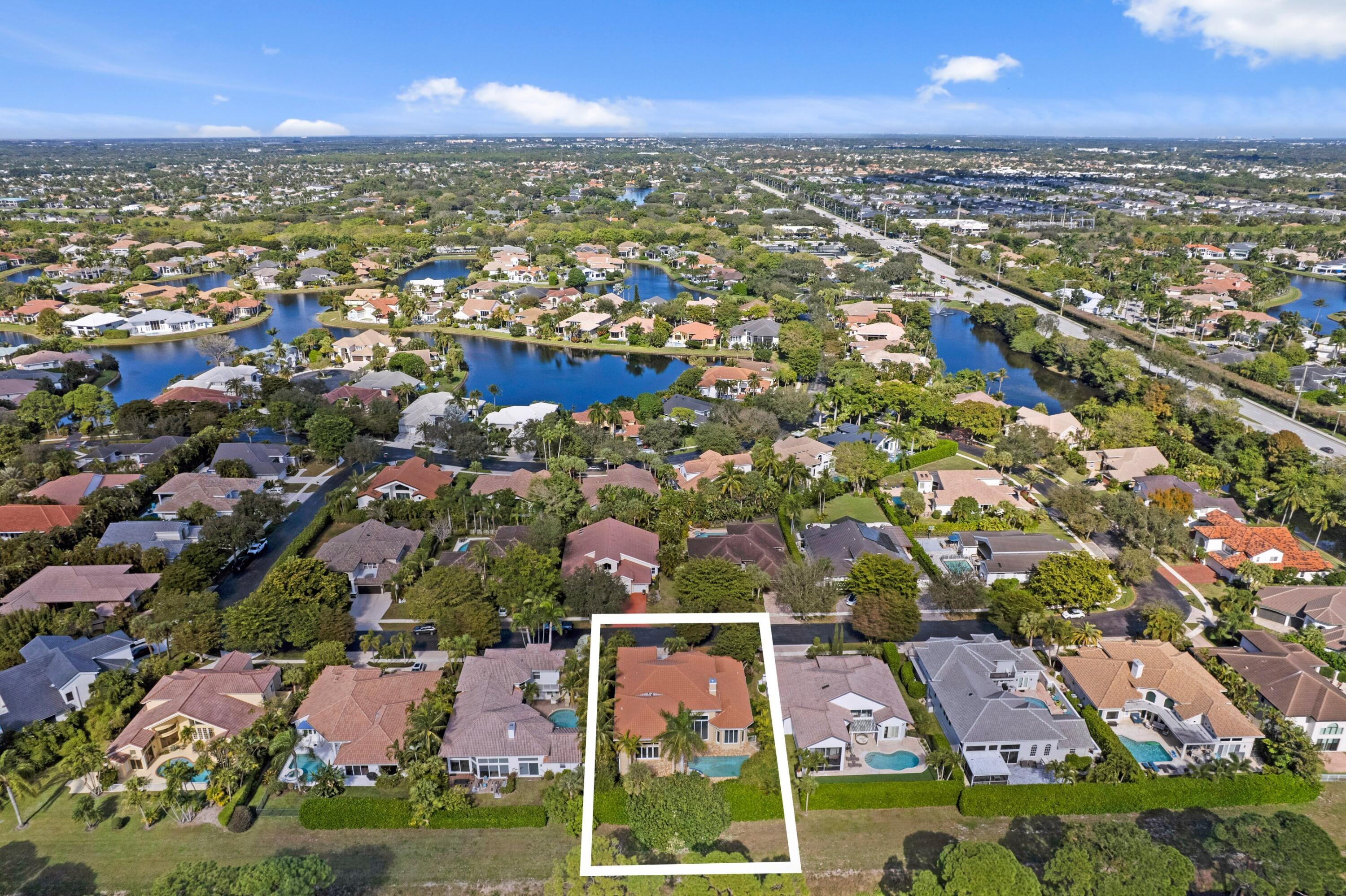 3054 Northwest 60th Street Boca Raton, FL 33496 - Photo 3 of 48 an aerial view of residential houses with outdoor space
