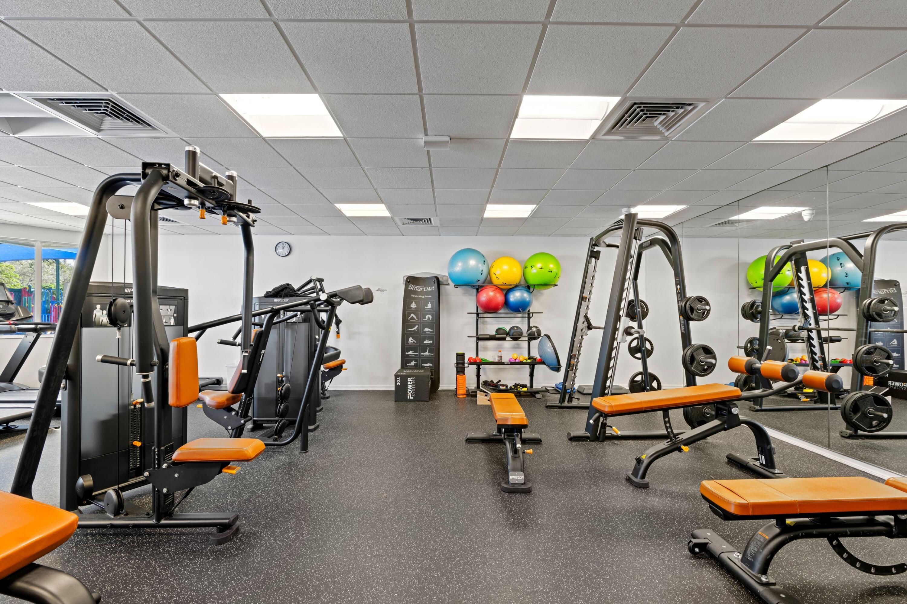3054 Northwest 60th Street Boca Raton, FL 33496 - Photo 34 of 48 a view of a room with gym equipment