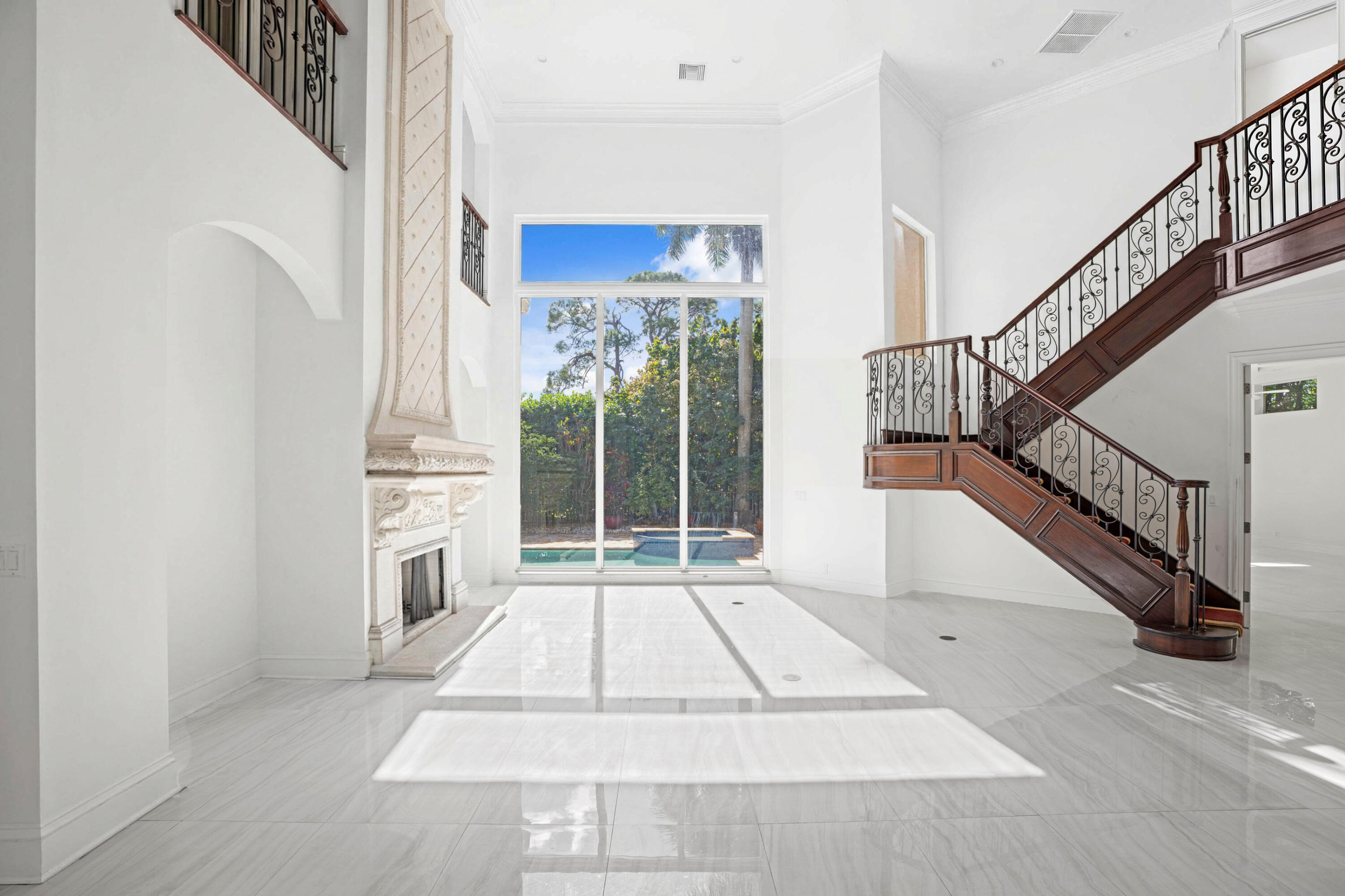 3054 Northwest 60th Street Boca Raton, FL 33496 - Photo 5 of 48 a view of entryway and hall with wooden floor