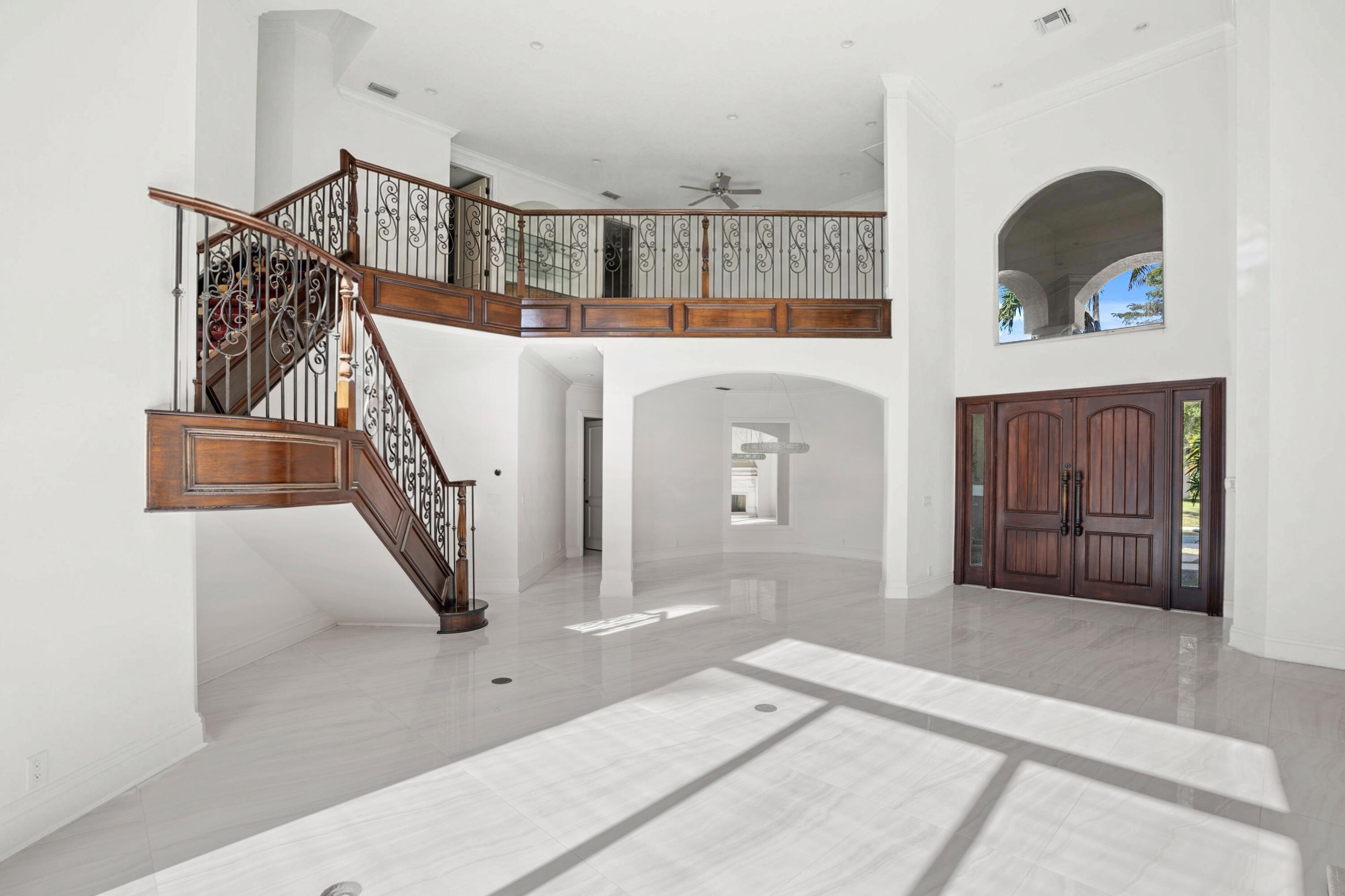 3054 Northwest 60th Street Boca Raton, FL 33496 - Photo 6 of 48 a view of a livingroom with furniture and staircase