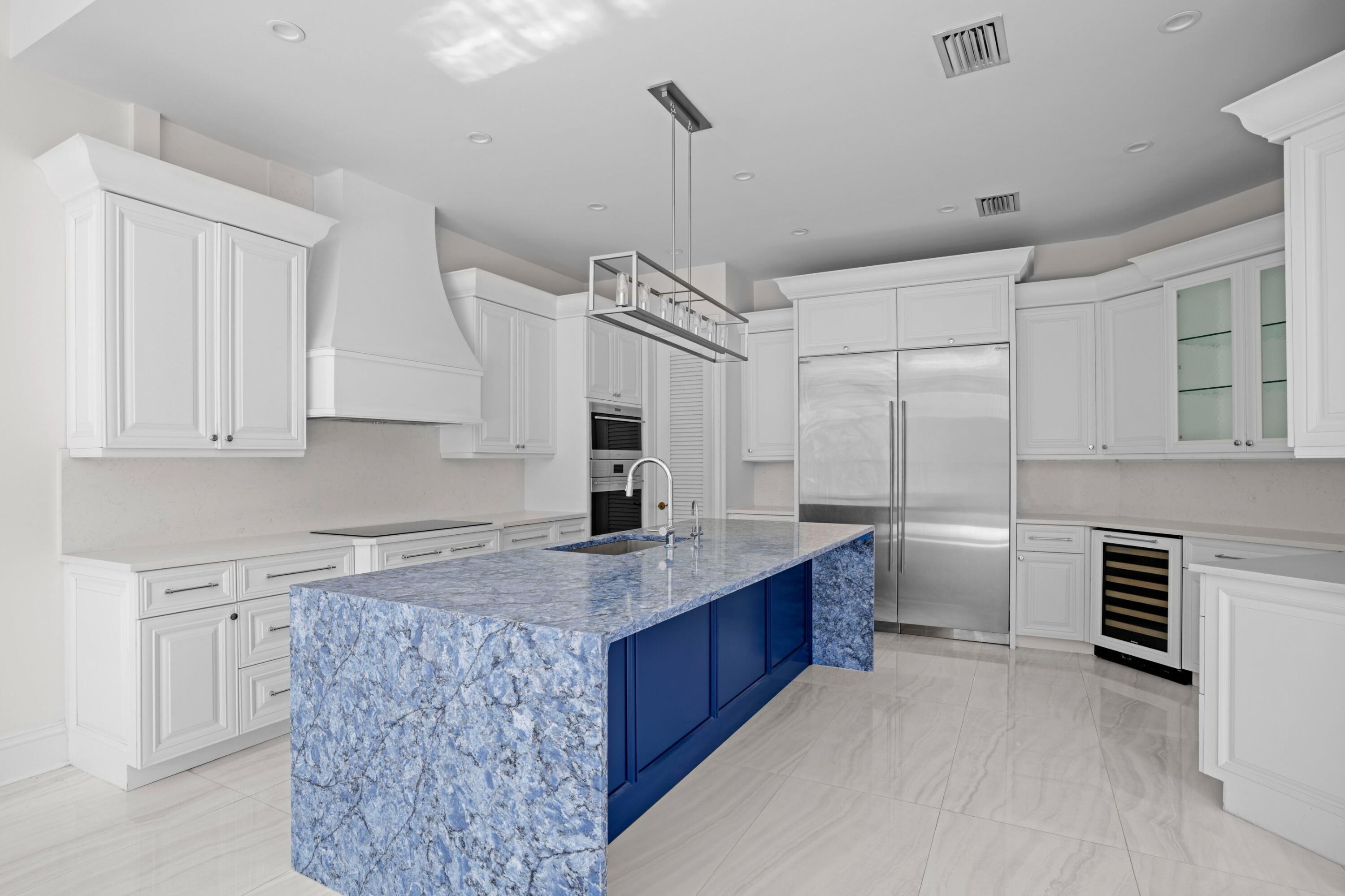 3054 Northwest 60th Street Boca Raton, FL 33496 - Photo 9 of 48 a kitchen with cabinets a sink and appliances