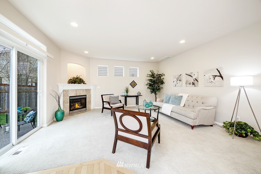 23606 17th Avenue West Bothell, WA 98021 - Photo 11 of 28 a living room with furniture and a fireplace