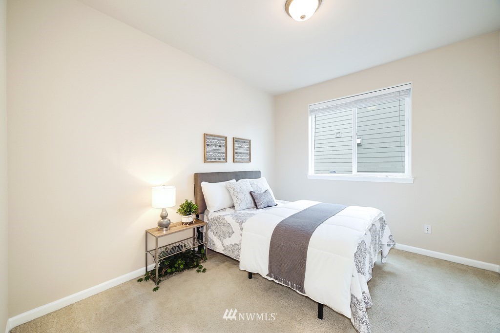 23606 17th Avenue West Bothell, WA 98021 - Photo 14 of 28 a bedroom with a bed and a window