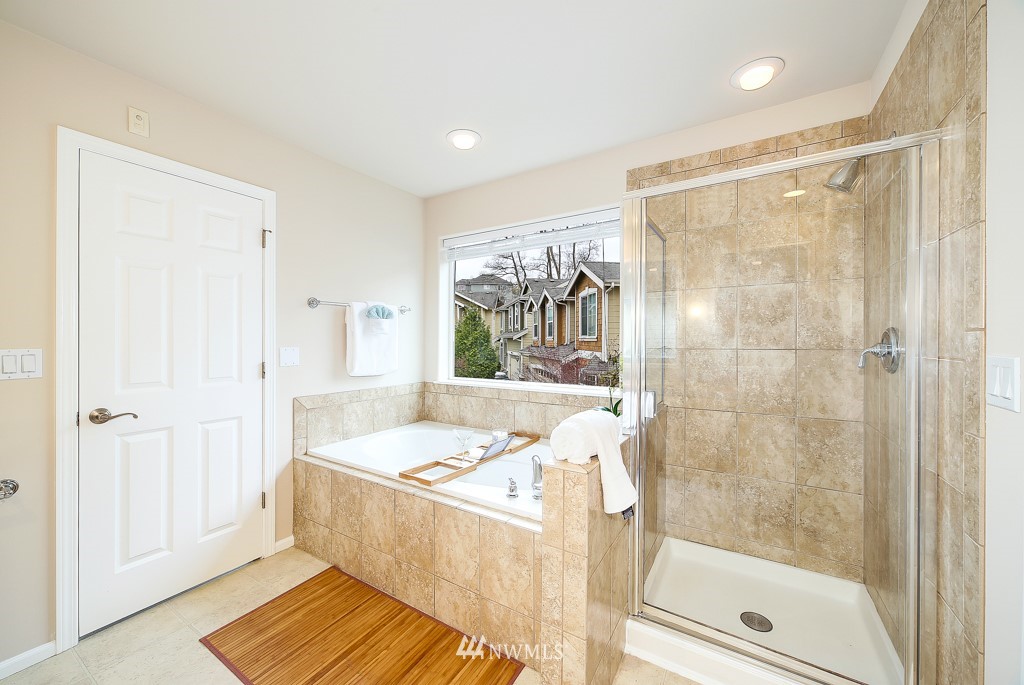 23606 17th Avenue West Bothell, WA 98021 - Photo 20 of 28 a bathroom with a bathtub and a shower