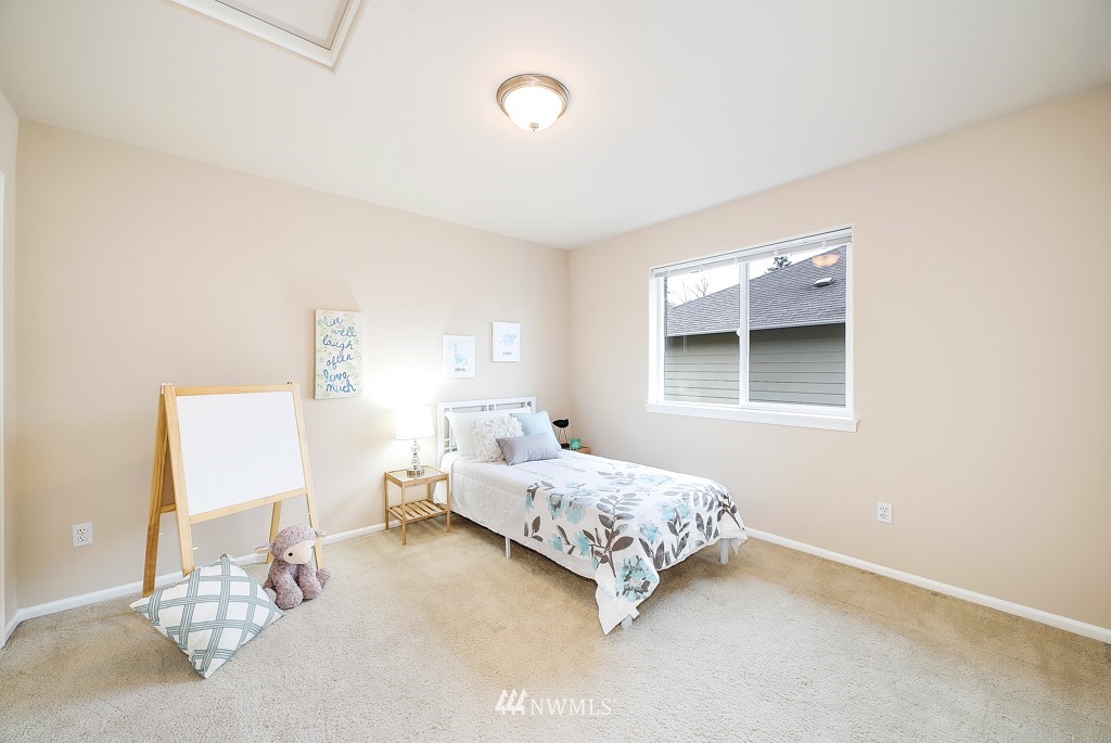23606 17th Avenue West Bothell, WA 98021 - Photo 23 of 28 a bedroom with a bed and a window