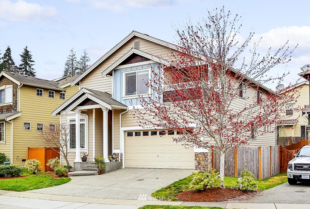 23606 17th Avenue West Bothell, WA 98021 - Photo 28 of 28 a front view of a house with a yard and potted plants