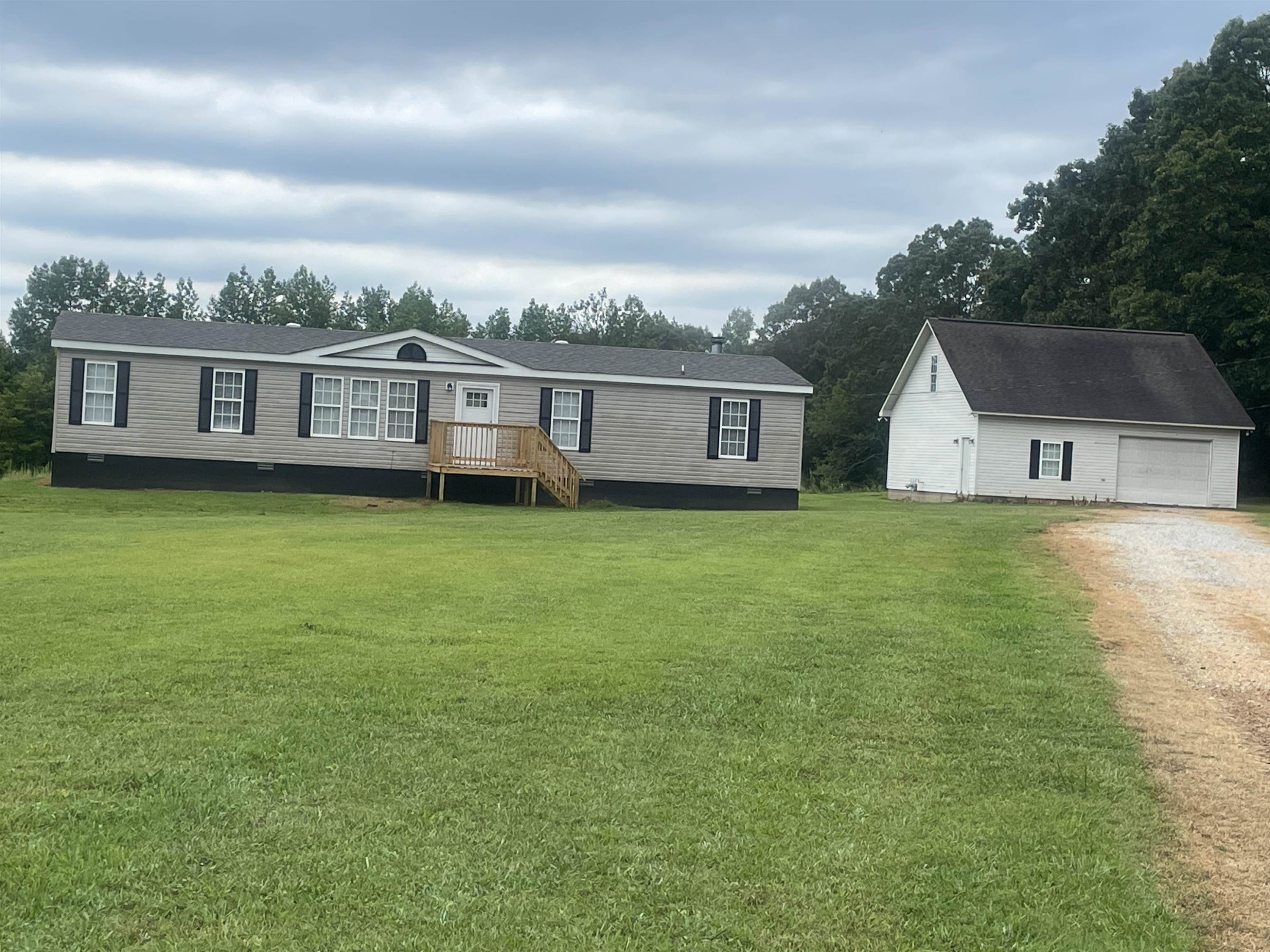 1175 Lott Road Henderson, TN 38340 - Photo 1 of 22 a view of a house with a yard and sitting area