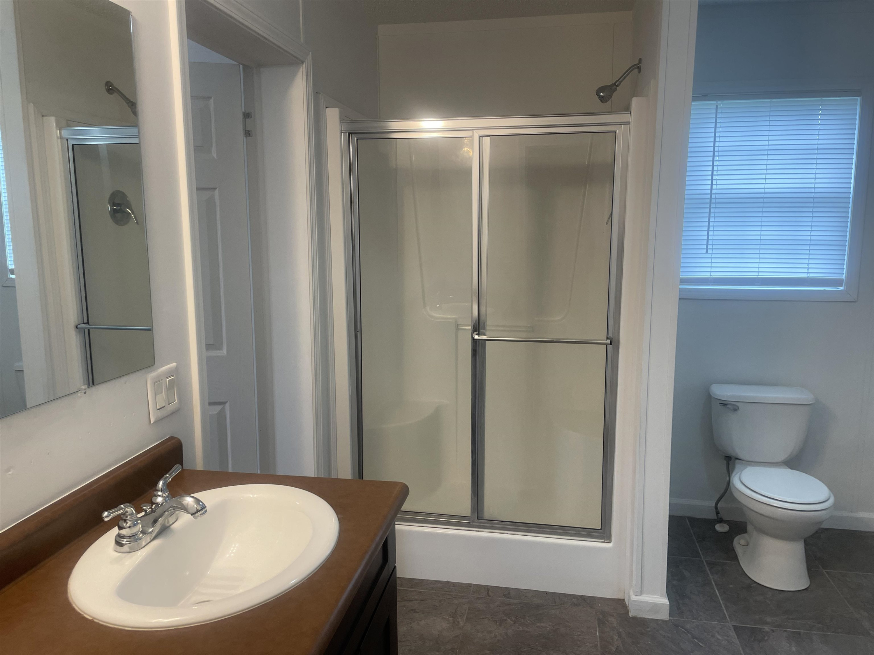 1175 Lott Road Henderson, TN 38340 - Photo 11 of 22 a bathroom with a sink toilet and shower