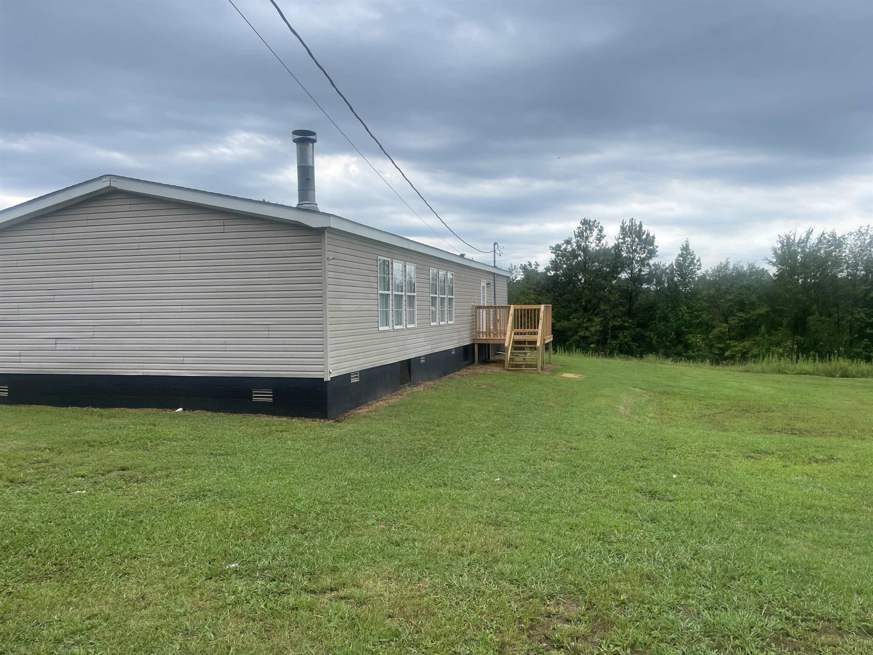 1175 Lott Road Henderson, TN 38340 - Photo 18 of 22 a view of a backyard with a garden
