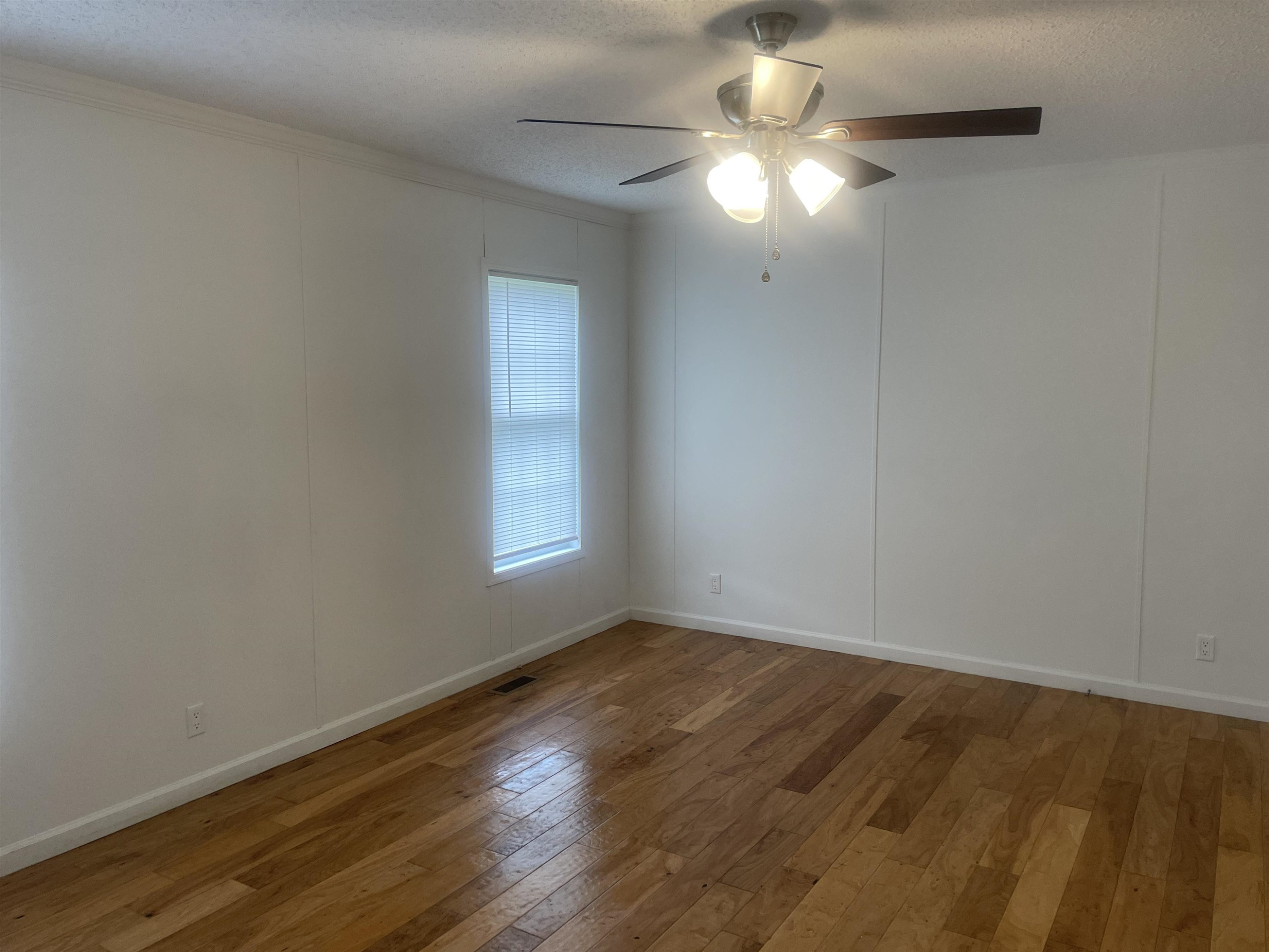 1175 Lott Road Henderson, TN 38340 - Photo 6 of 22 wooden floor in an empty room with a window