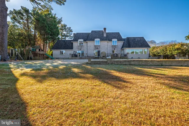 a kitchen with stainless steel appliances a white stove top oven and a refrigerator with white cabinets