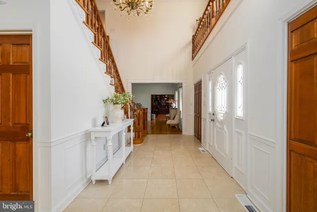 a view of a dining room with furniture large windows and wooden floor