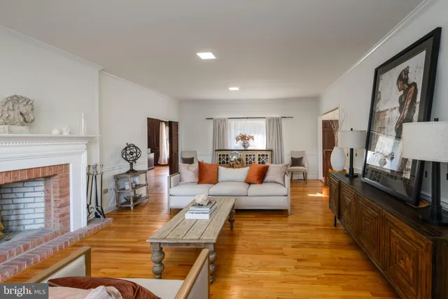 a bedroom with a bed and dresser with mirror