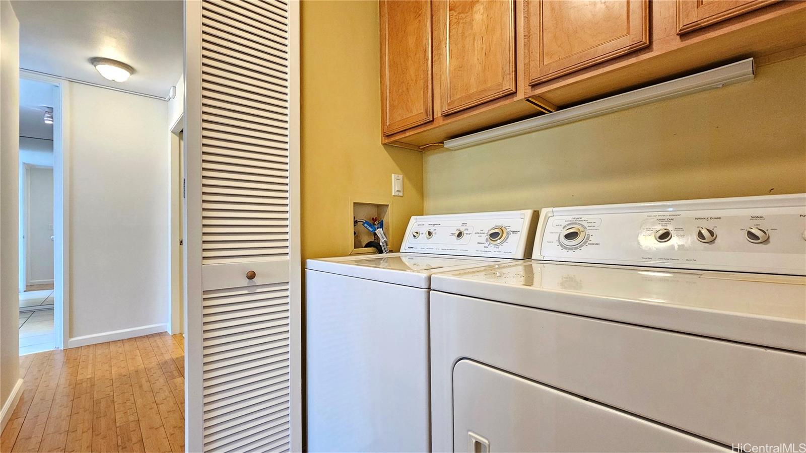 3138 Waialae Avenue, Unit 422 Honolulu, HI 96816 - Photo 14 of 25 a utility room with dryer and washer