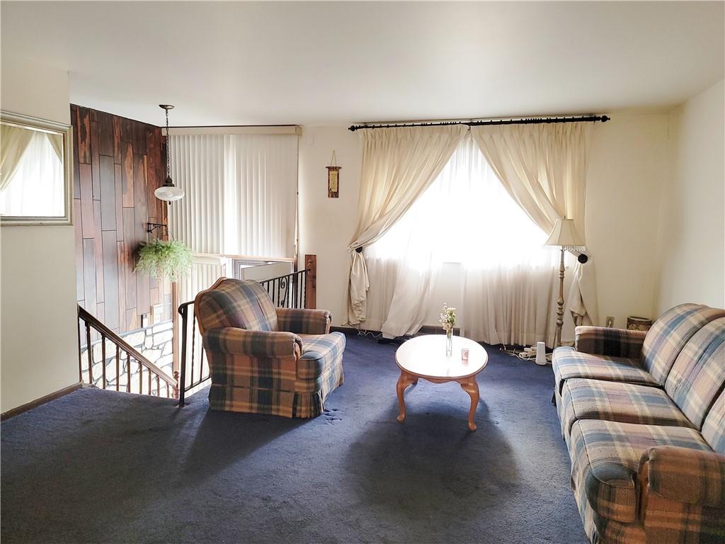 632 Monaca Road Aliquippa, PA 15001 - Photo 6 of 9 a living room with furniture and a large window
