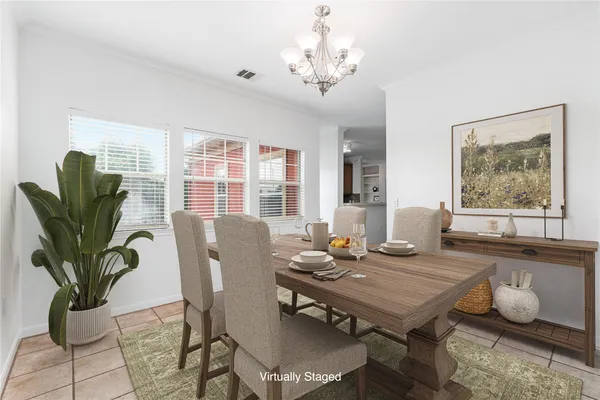 a large white kitchen with cabinets