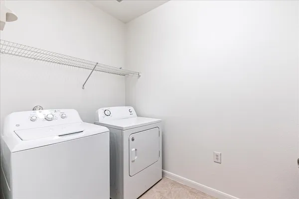 a view of a house with swimming pool and sitting area