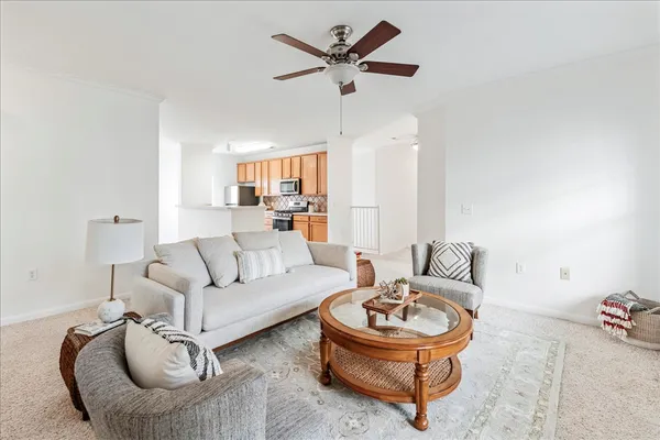 a living room with furniture and a window