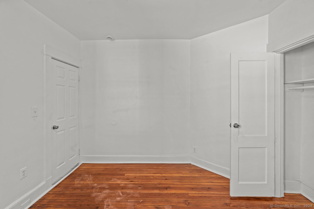 56 Blake Street, Unit 2 New Haven, CT 06511 - Photo 11 of 16 a view of empty room with wooden floor