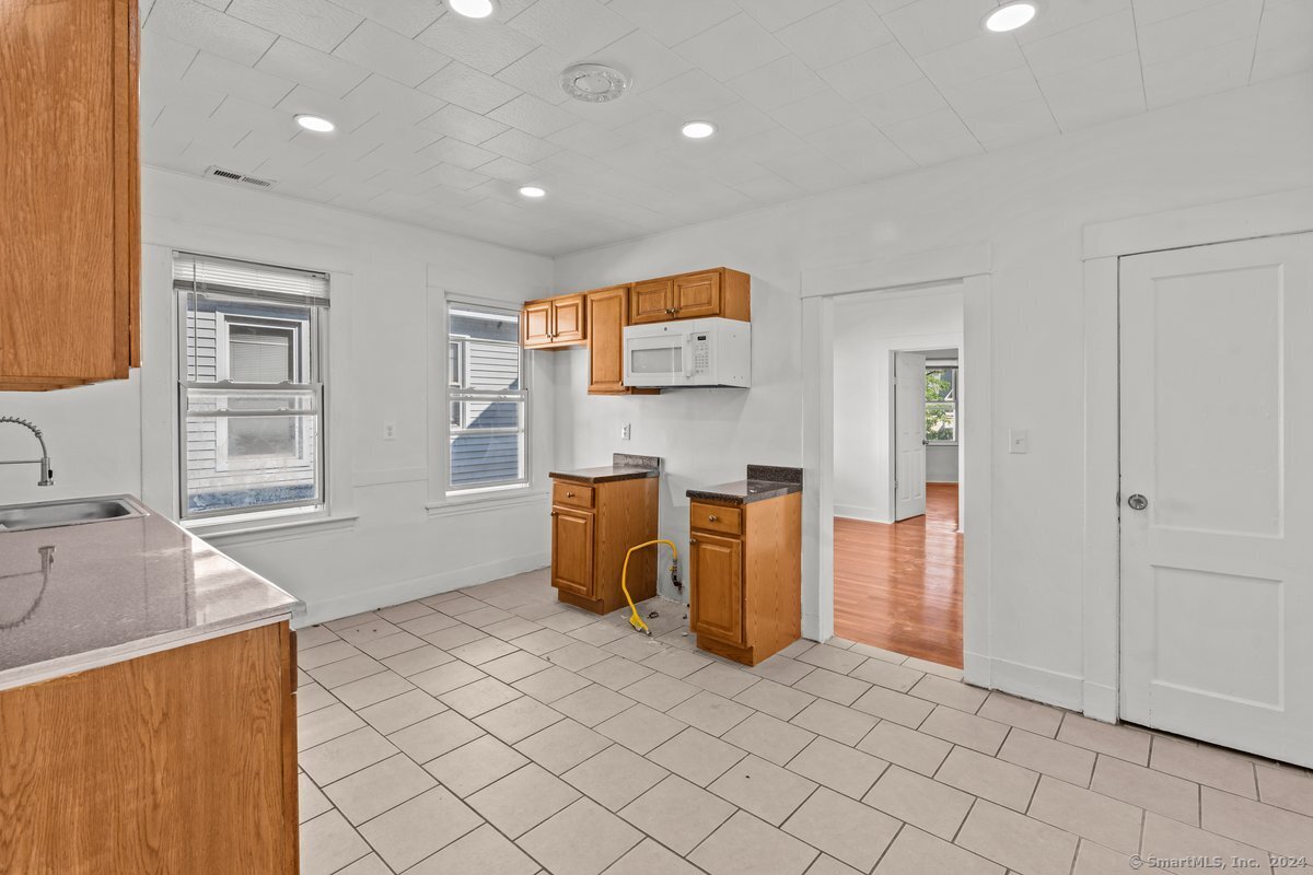 56 Blake Street, Unit 2 New Haven, CT 06511 - Photo 2 of 16 a view of kitchen and windows