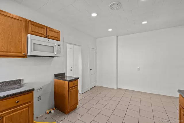 a view of cabinets and wooden floor