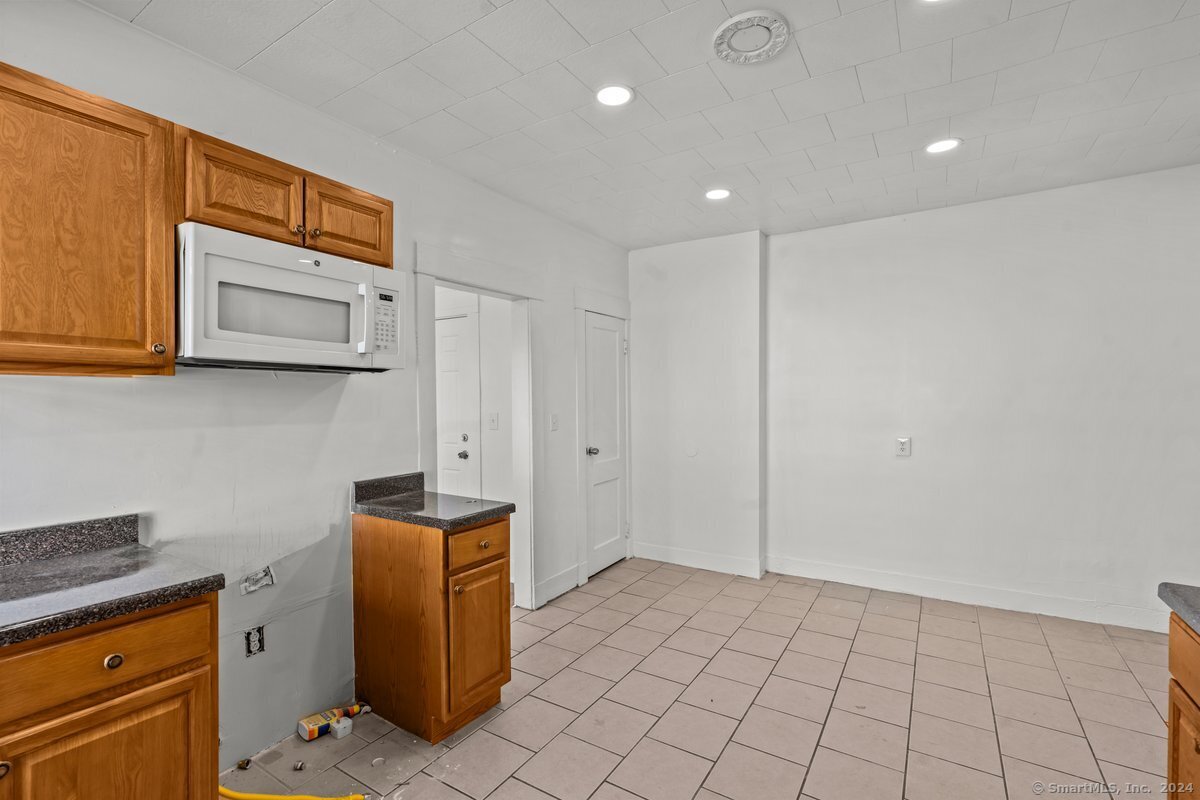 56 Blake Street, Unit 2 New Haven, CT 06511 - Photo 4 of 16 a view of cabinets and wooden floor