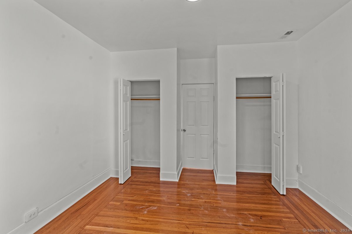 56 Blake Street, Unit 2 New Haven, CT 06511 - Photo 7 of 16 a view of an empty room with wooden floor