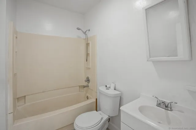 a bathroom with a sink toilet and bathtub