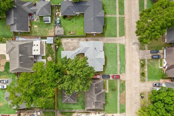 an aerial view of a houses with outdoor space and street view