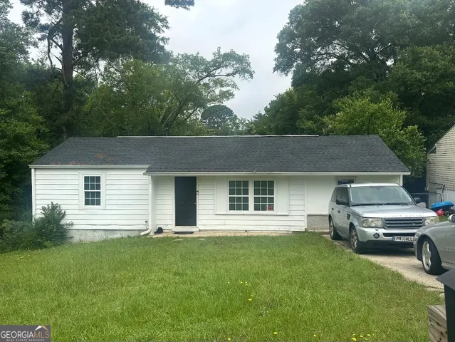 a house view with a garden space