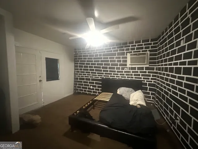 a view of a house with a yard and potted plants