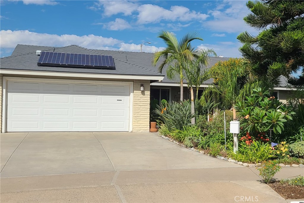 719 Cobb Avenue Placentia, CA 92870 - Photo 1 of 18 a front view of a house with a yard and garage
