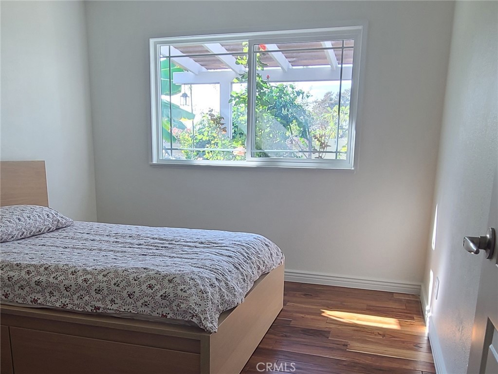 719 Cobb Avenue Placentia, CA 92870 - Photo 12 of 18 a bedroom with a bed and a window