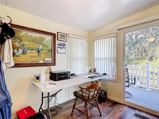 a dining room with furniture and wooden floor