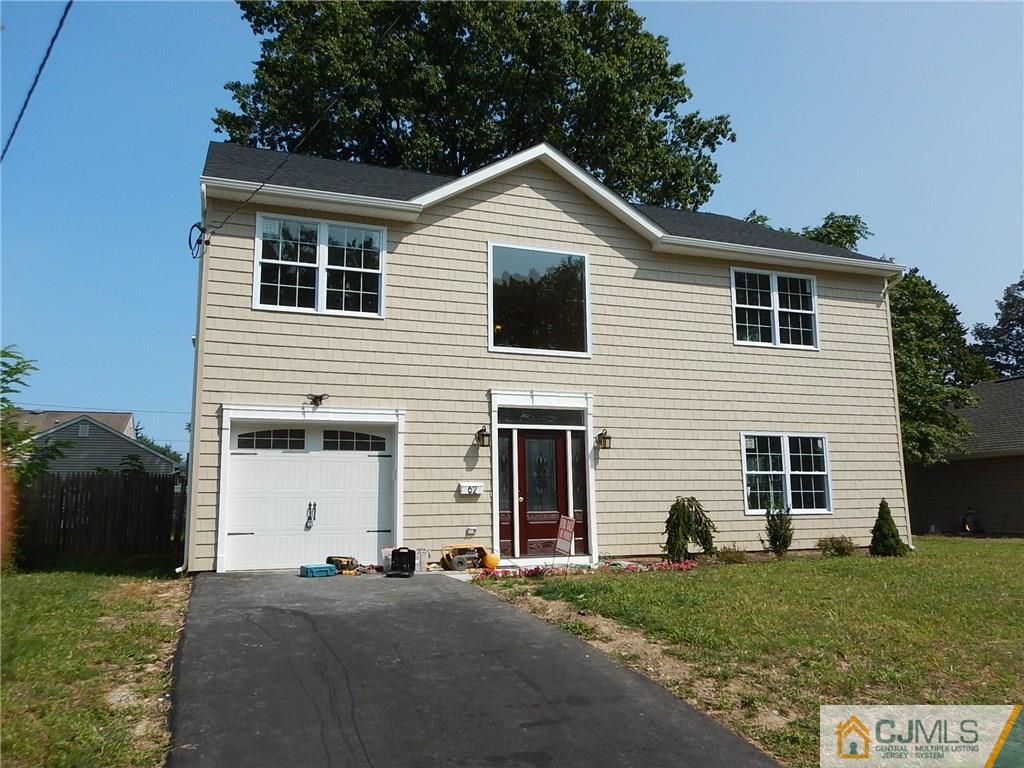 62 Idlewild Road Edison, NJ 08817 - Photo 1 of 11 a front view of a house with a yard